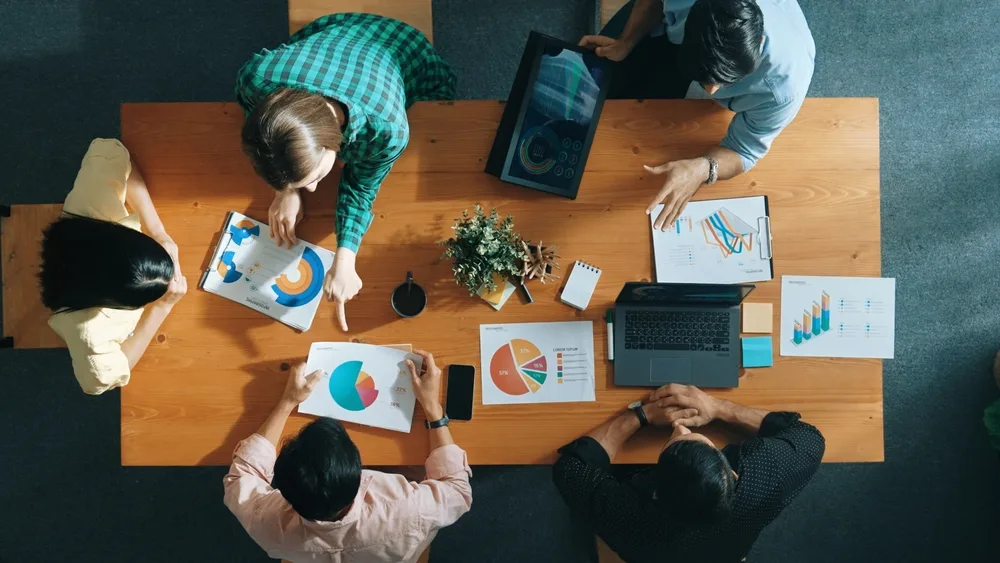 group round a table for marketing