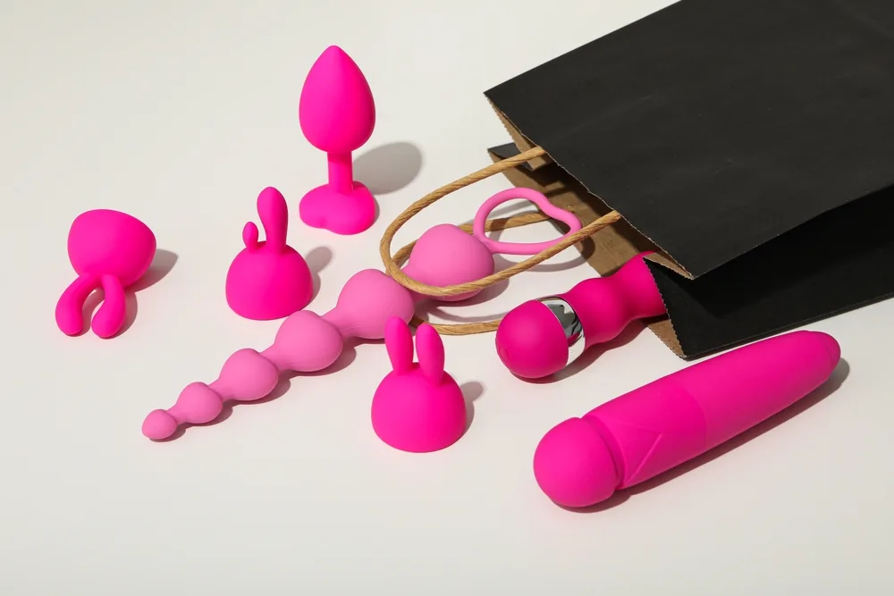 Sex Toys Spilling Out Of A Paper Bag Side View